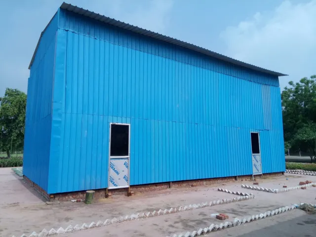 Prefabricated blue metal-sheet shed, completed